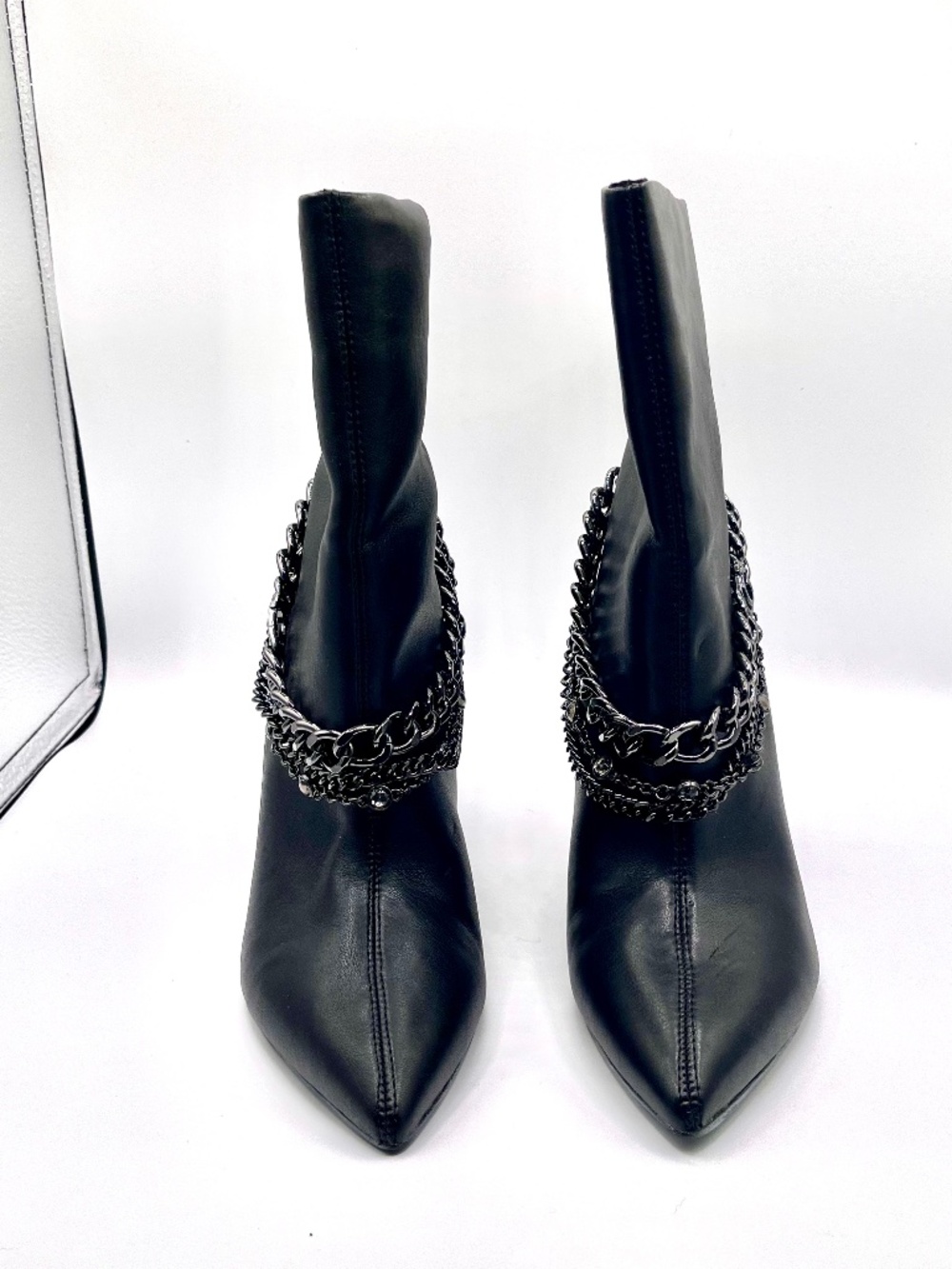 Guess Dasilda black leather ankle bootie with decorative black chains